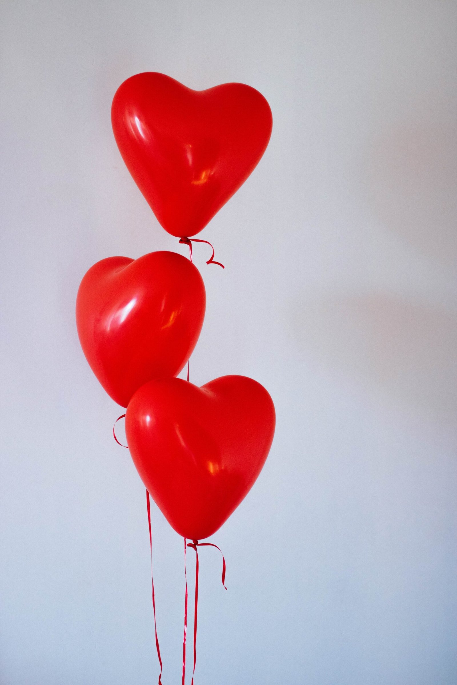three heart shaped baloons