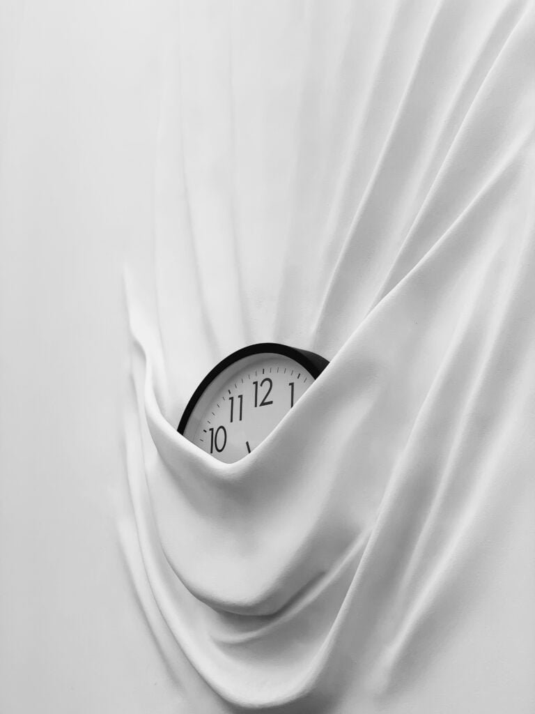 A dreamlike clock that has fused with a wall