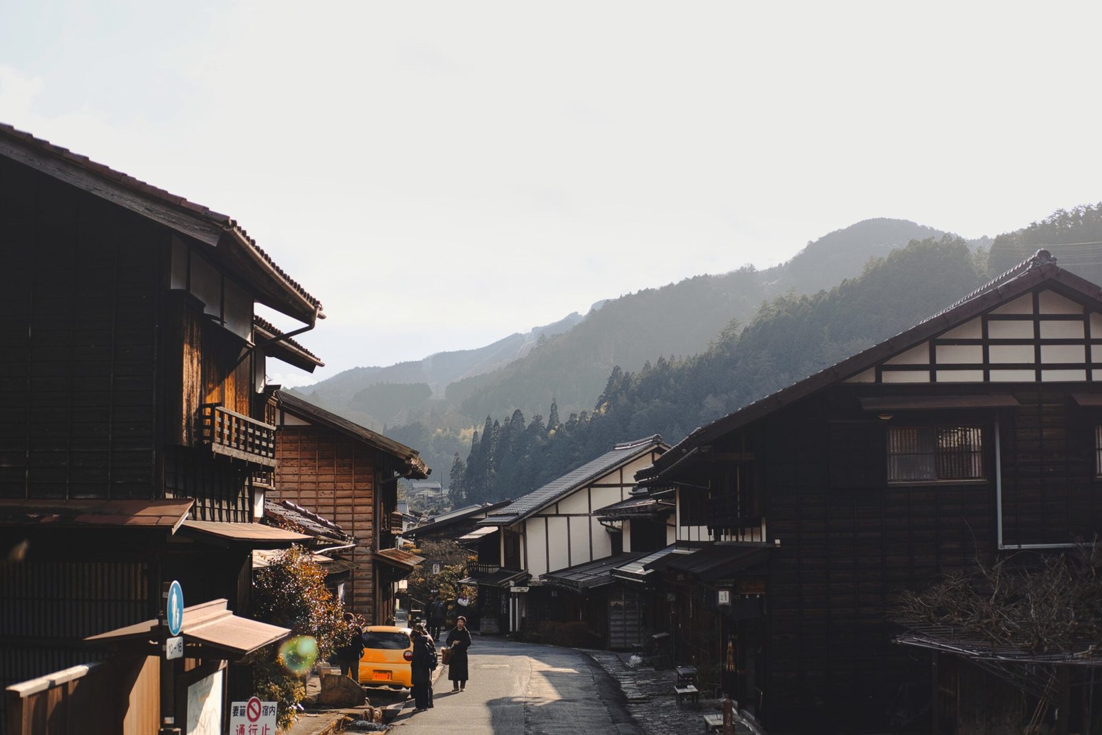 A photograph of a village street in the mountains