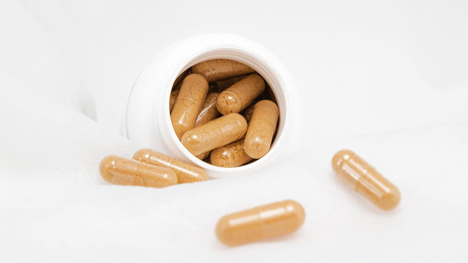 A pill bottle containing supplements that may improve healthy sleep