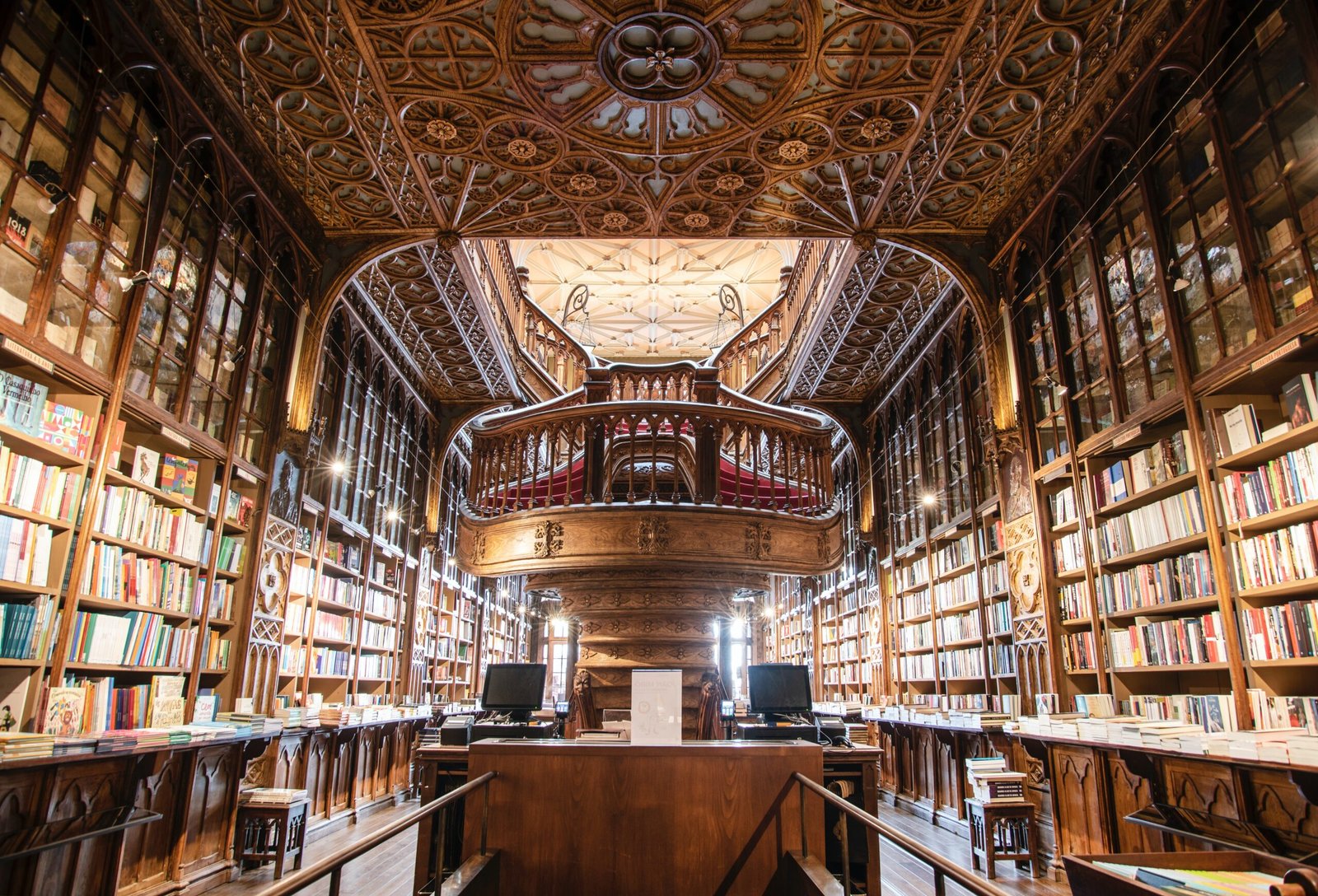 An old and intricate wooden library, filled with books