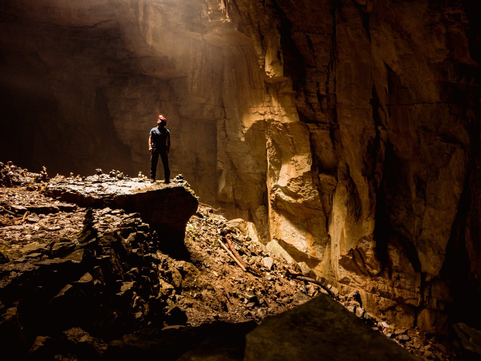 A man standing inside a cave